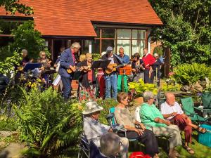 The ukulele band perform.